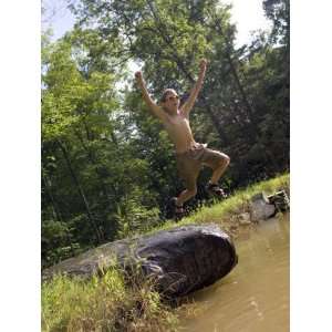 9 Year Old Boy Jumping Off a Rock into a Pond, Woodstock 