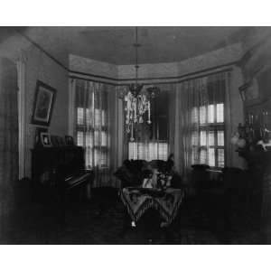  1899 photo Interior view of room showing furniture, piano 