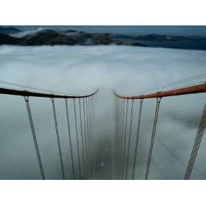 Cables of the Golden Gate Bridge Stand Above the Early Morning Fog 