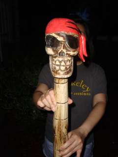 You are bidding on a AWESOME Handcarved wood 43 inch long SKULL TIKI 