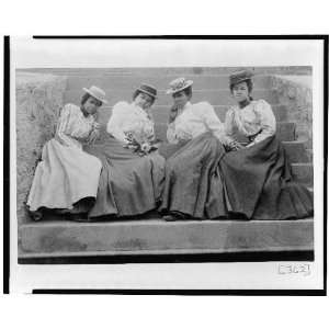  Four African American women on steps of building at 
