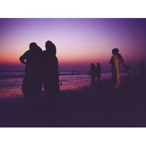  Muslim Women in Saris Watch a Spectacular Sunset from a 