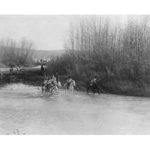   Group of Native Americans on horseback, crossing a river. Home