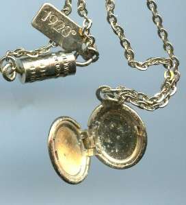   Locket measures 1/2 chain 15 1/2 little tag at the catch says 1928