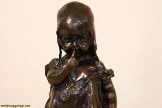 this bronze sculpture of a little girl standing on a stool is after a 