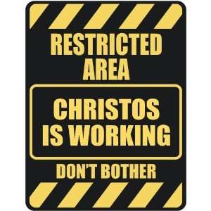   RESTRICTED AREA CHRISTOS IS WORKING  PARKING SIGN