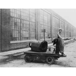  1914 photo Woman standing on electric shop truck 