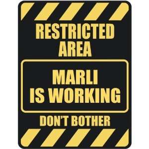   RESTRICTED AREA MARLI IS WORKING  PARKING SIGN