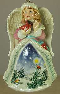 PORCELAIN CHRISTMAS ORNAMENT ANGEL IN WINTER CLOTHES HOLDING RED 