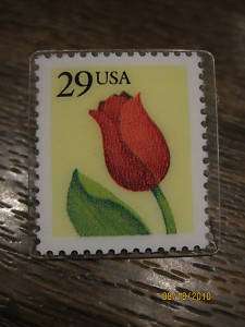 VNTG 29 cent stamp laminated on tie tac pin  
