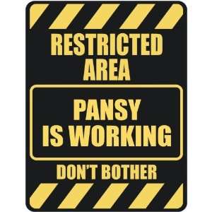   RESTRICTED AREA PANSY IS WORKING  PARKING SIGN