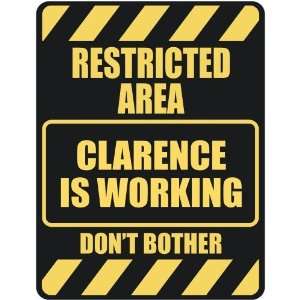   RESTRICTED AREA CLARENCE IS WORKING  PARKING SIGN