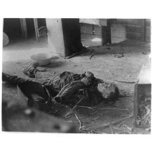   ,Germany,body of dead man lying on floor,April 1945
