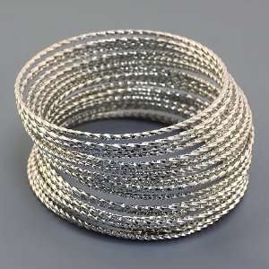  Layered Bangle Set; 24 individual diamond cut bangles as 