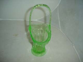 green depression glass basket. Glows in black light  