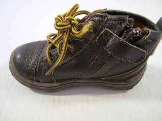 This is a pair of brown Carters boys boots . The boots are a size 7M 