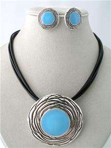 SILVERTONE CIRCLE PENDANT BLUE EPOXY BLACK CORD SET  