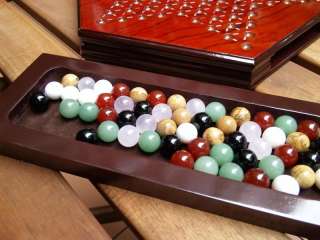 This is a brand new luxury Chinese checkers set. The playing marbles 