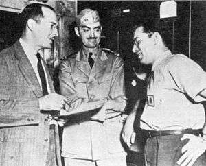 Sprague de Camp (center) with Robert A. Heinlein and Isaac 