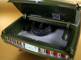 Trunk features full floor mat with mounted spare tire & jack. Detailed 